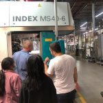 Parents and friends inspecting the index machine at Avanti.